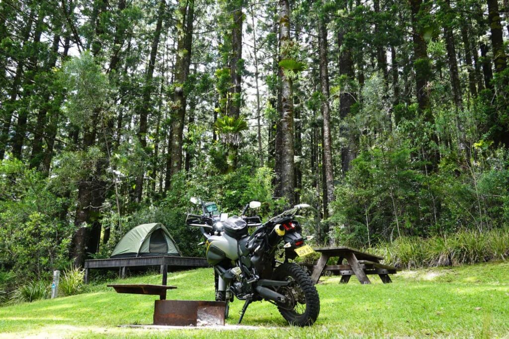 Motorcycle with campground set up in Byron Bay